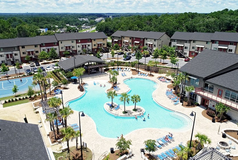 Redpoint West Tenn Apartments Amenities Massive pool and basketball courts located right outside of the apartment complex